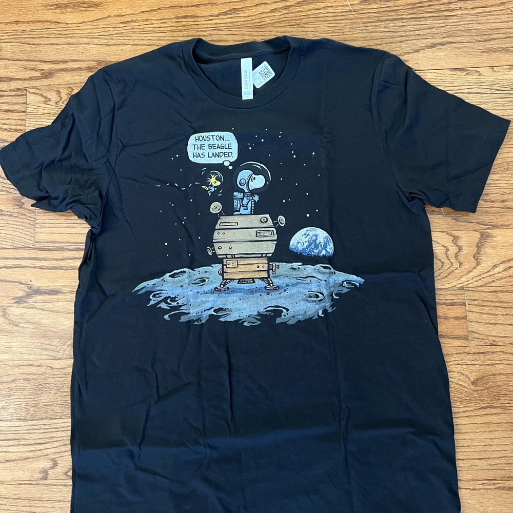 Snoopy. Bella Canvas Black Short Sleeve Tee with Space-Themed Print